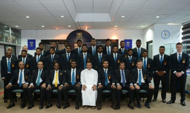 Sri Lankan Sports Minister Dayasiri (C) with the country's cricket team as they prepare to