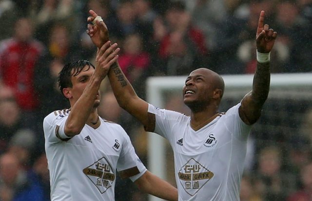 Two goals from Andre Ayew (R) and one from Jack Cork (L) at the Liberty Stadium on Sunday