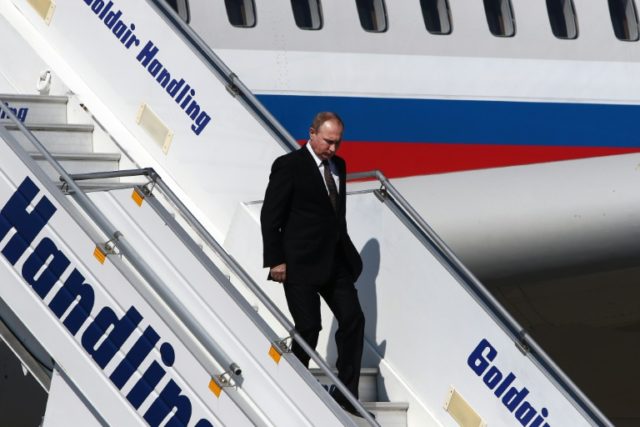Russian President Vladimir Putin (C) arrives at the Athens international Airport, on May 2