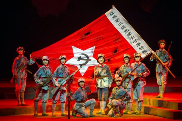 Performers dancing and singing during a Chinese national opera of the "Red Detachment of W