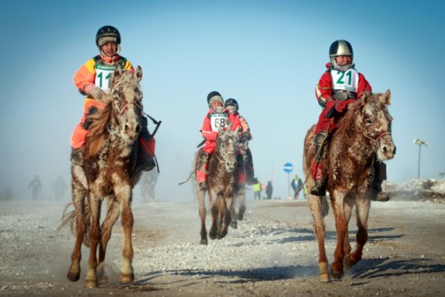 Child jockeys compete during a winter race in Argalant district of Tov Province, west of M