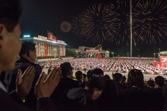 Spectators applaud during a parade on Kim Il-Sung square during festivities marking the en