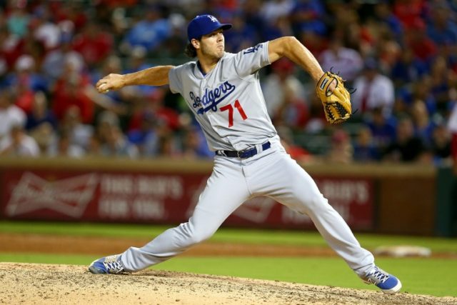 Josh Ravin of the Los Angeles Dodgers pitches in the ninth inning during a game against th