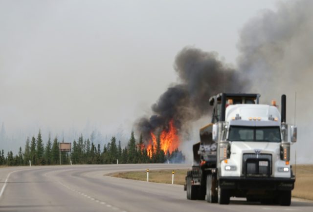 The wildfire in Alberta oil sands region doubled in size in one day, covering more than 20