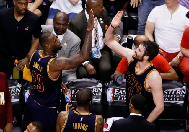 LeBron James (L) and Kevin Love of the Cleveland Cavaliers celebrate their 113-87 win over