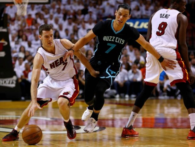 Goran Dragic #7 of the Miami Heat drives on Jeremy Lin #7 of the Charlotte Hornets during