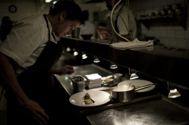 Chilean chef Rodolfo Guzman works in the kitchen at Borago restaurant in Santiago on May 1