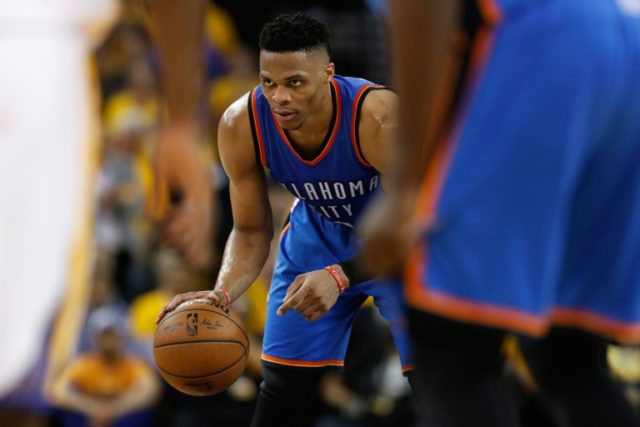 Russell Westbrook of the Oklahoma City Thunder looks to drive through the defence of the G
