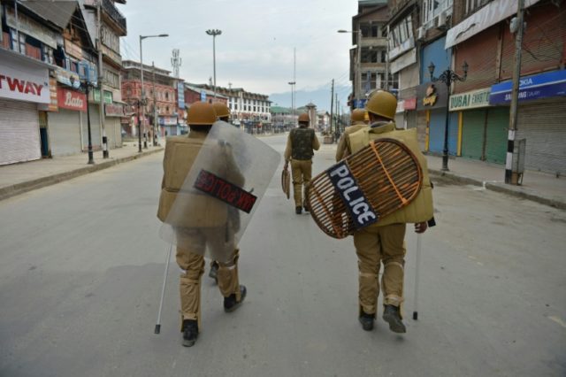 Indian paramilitary troops patrol in Srinagar, where a uspected leader of the Pakistani mi