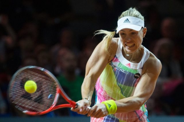 Germany's Angelique Kerber returns the ball in the final of the WTA Porsche Tennis Grand P