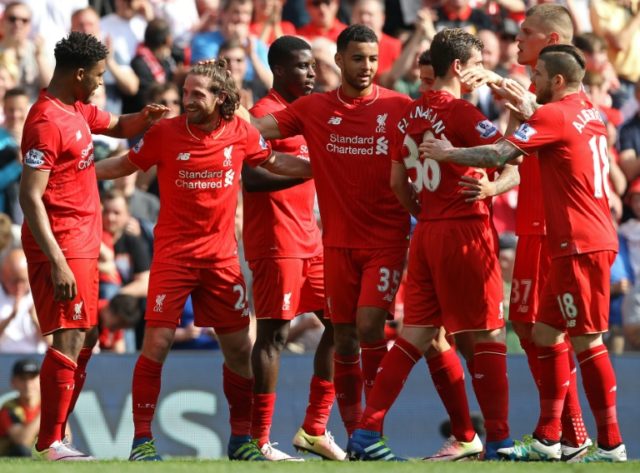 Liverpool's Joe Allen (2nd L) celebrates with teammates after scoring a goal during their