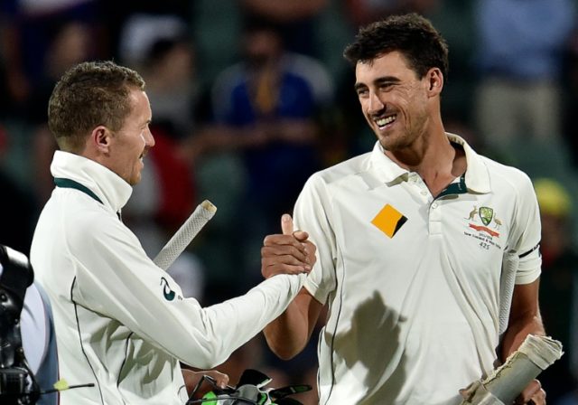 Mitchell Starc (R) has been out of action since fracturing his foot in last November's day