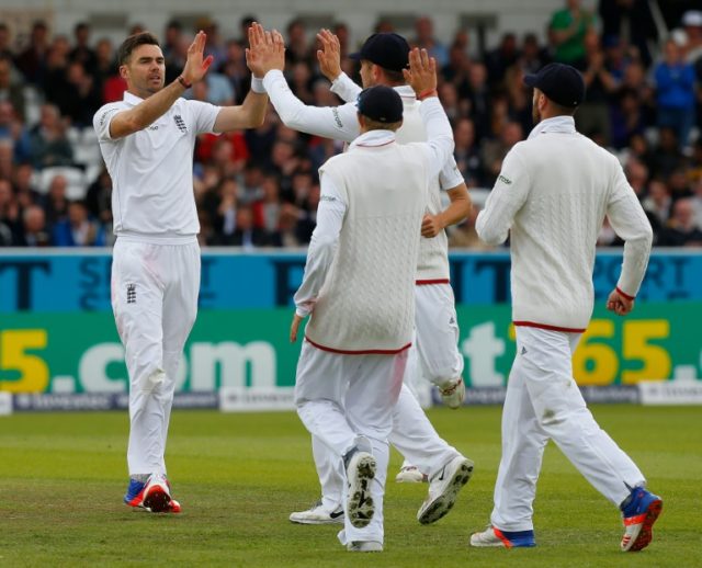 England's James Anderson (L) celebrates after taking the wicket of Sri Lanka's Dasun Shana