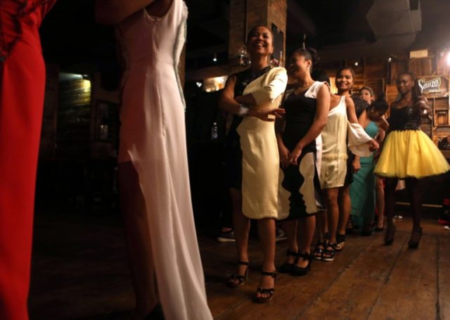 Domestic workers take part at a modelling show in central Beirut organised by local NGO In