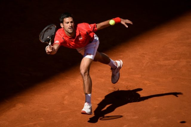 Serbian tennis player Novak Djokovic returns a ball to Croatian tennis player Borna Coric