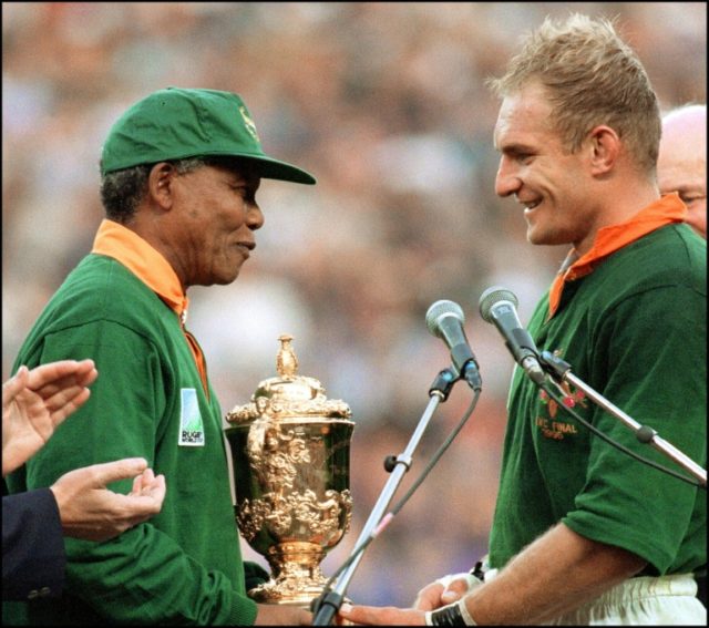 Nelson Mandela hands South Africa captain François Pienaar the Webb Ellis Cup at the end