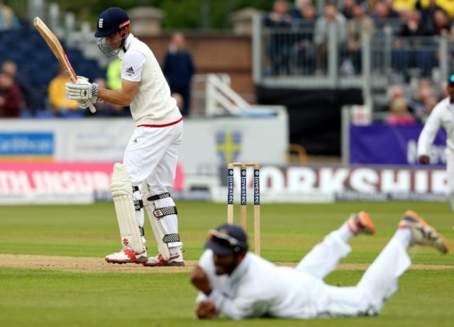 England captain Alastair Cook is caught by Sri Lanka's Dimuth Karunaratne for 15 on the fi