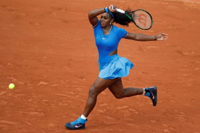 US player Serena Williams returns the ball to Brazil's Teliana Pereira during their women'