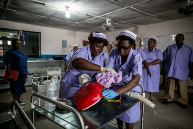 Students at the Masuba Midwifery School in Sierra Leone practice cardiopulmonary resuscita