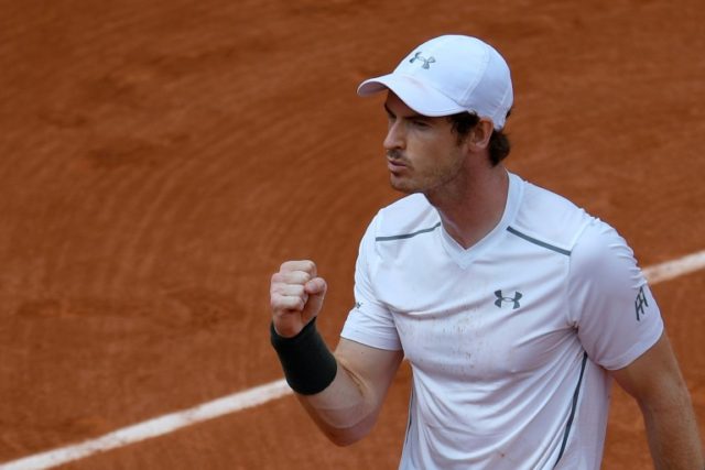 Britain's Andy Murray celebrates after beating Croatia's Ivo Karlovic during their third r