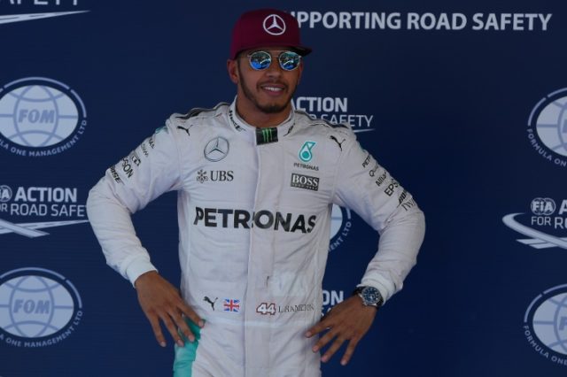 Mercedes driver Lewis Hamilton celebrates after the qualifying session for the Spanish Gr
