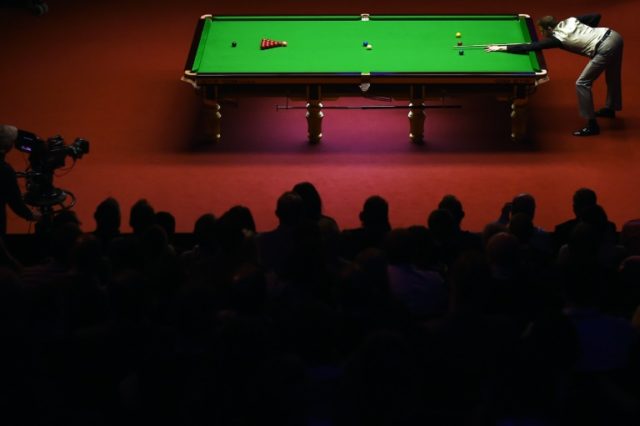 England's Mark Selby plays a shot during the third session of the World Snooker Championsh