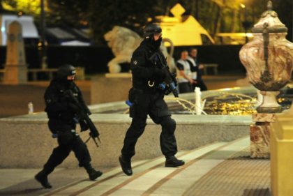 Armed response units respond to a mock suicide bombing during a terror training exercise at a shopping centre in Manchester on May 10, 2016
