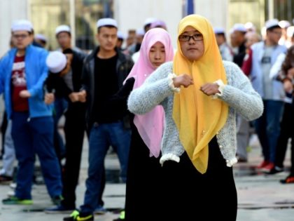 Chinese Hui Muslim students during an exercise session on the campus of the Ningxia Islami