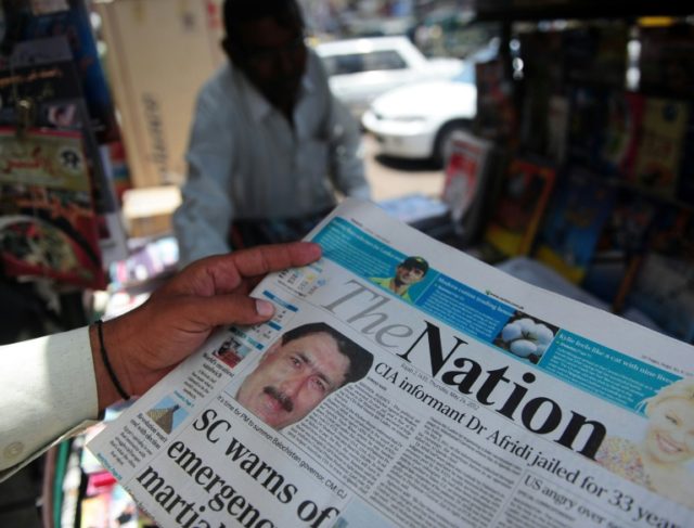 A newspaper bears the photograph of Pakistani surgeon Shakeel Afridi, recruited by the CIA