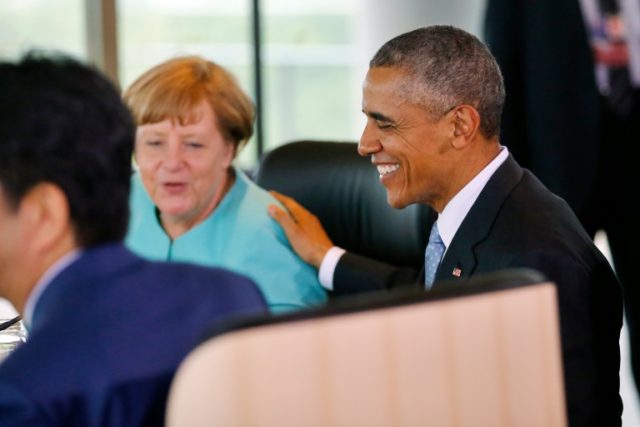 German Chancellor Angela Merkel (C) and US President Barack Obama (R) chat at the 2016 G7