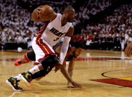 Dwyane Wade (L) scores 30 points as the Miami Heat even their second-round playoff series with a 94-87 win over Toronto