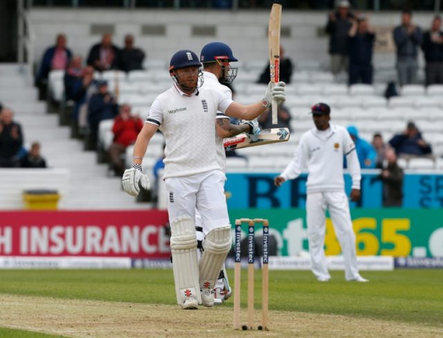 England's Jonny Bairstow celebrates reaching his half-century during the first Test agains