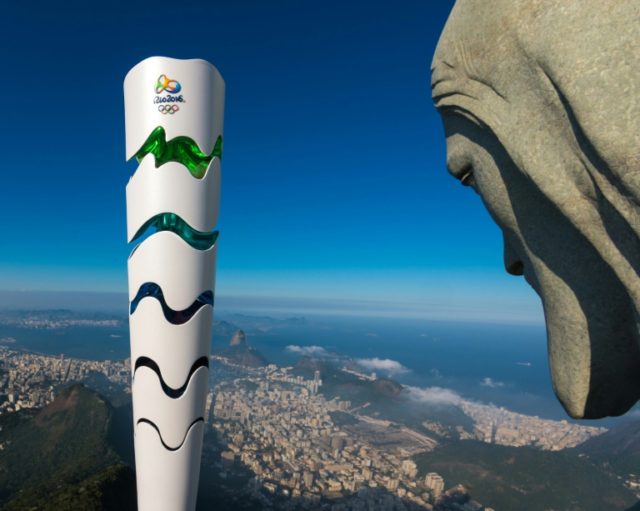 The Olympic torch beside Rio's landmark, the staute of Christ the Redeemer, ahead of the O