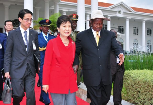 During a summit with visiting South Korean President Park Geun-Hye (C), Uganda's President