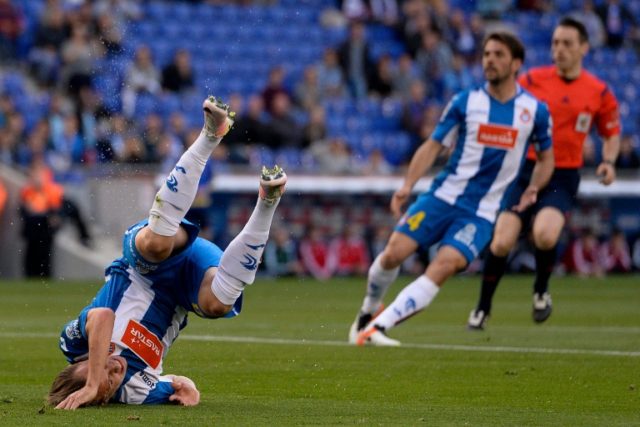 Espanyol's Abraham Gonzalez falls during the match against RC Celta de Vigo at the Cornell