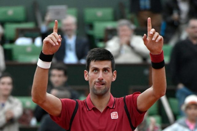 Novak Djokovic celebrates after winning his men's third round match against Aljaz Bedene a