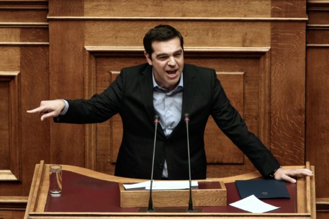 Greek Prime Minister Alexis Tsipras delivers a speech during a parliamentary session in At