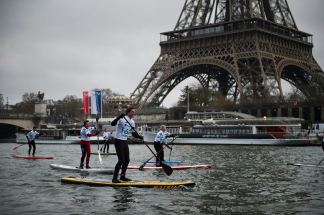 A paddle-boat race takes place on the River Seine in Paris