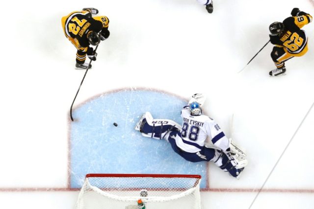 Patric Hornqvist of the Pittsburgh Penguins scores a goal past Andrei Vasilevskiy of the T