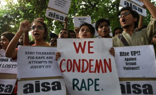 Indian students shout slogans during a protest against rapes, in New Delhi, in October 201