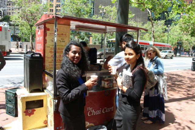 Jyothi Lakshmaiah (L) and Nithya Krishnan (R) take a break from their jobs to enjoy chai