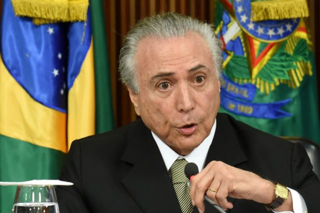 Acting Brazilian President Michel Temer presents his economic measures during a meeting wi