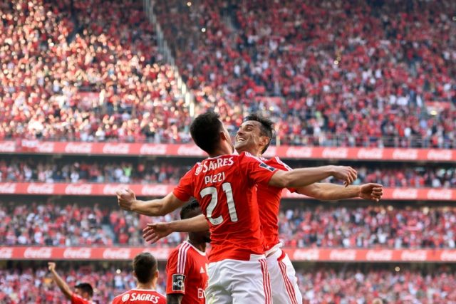 Benfica's forward Luis Fernandes "Pizzi" (L) celebrates a goal with forward Jonas Oliveira