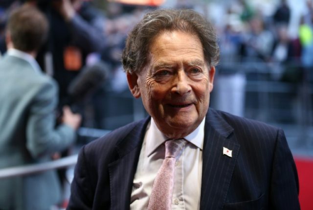 Former British Conservative Party Minister Nigel Lawson poses for pictures as he arrives f