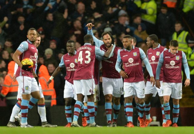 Aston Villa players celebrate during an English Premier League football match at Villa Par