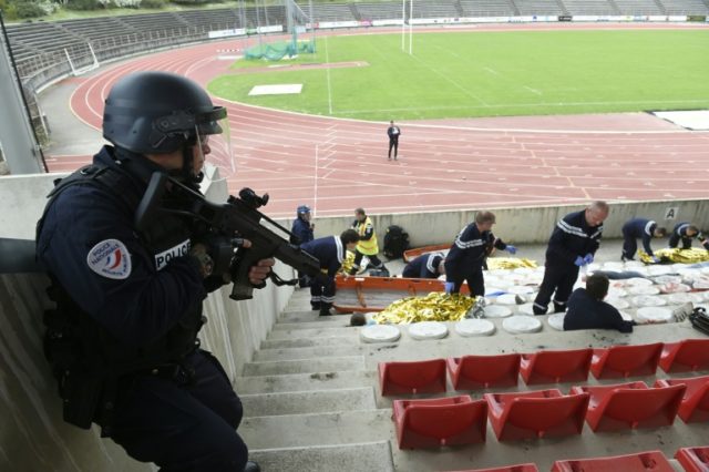 Police and firefighters take part in a mock terror attack exercise at the Georges Pompidou