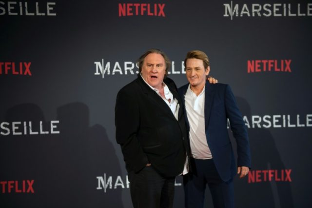 French actors Gerard Depardieu (L) and Benoit Magimel pose during a photocall for the prem