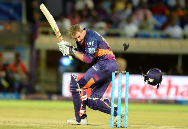 The helmet of rising Pune Supergiants batsman George Bailey goes flying after it was hit b