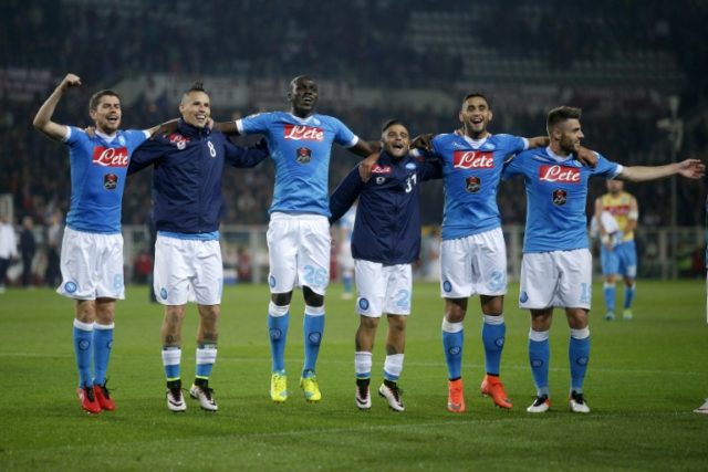 Napoli's players celebrate victory at the end of their Italian Serie A match against Torin