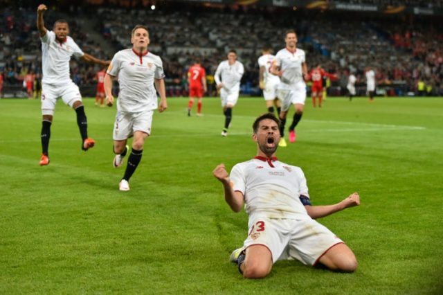 Sevilla's defender and captain Coke (R) celebrates after scoring a goal during the UEFA Eu